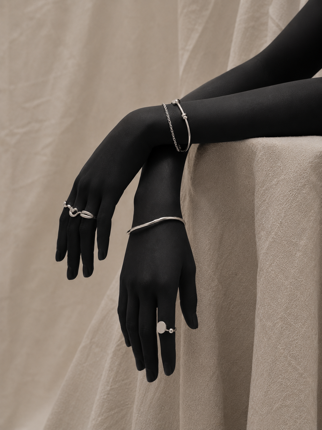 Hand with bracelet on drape